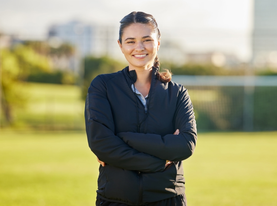 Soccer woman and coach portrait on field for match game in Mexico with optimistic and joyful smile.